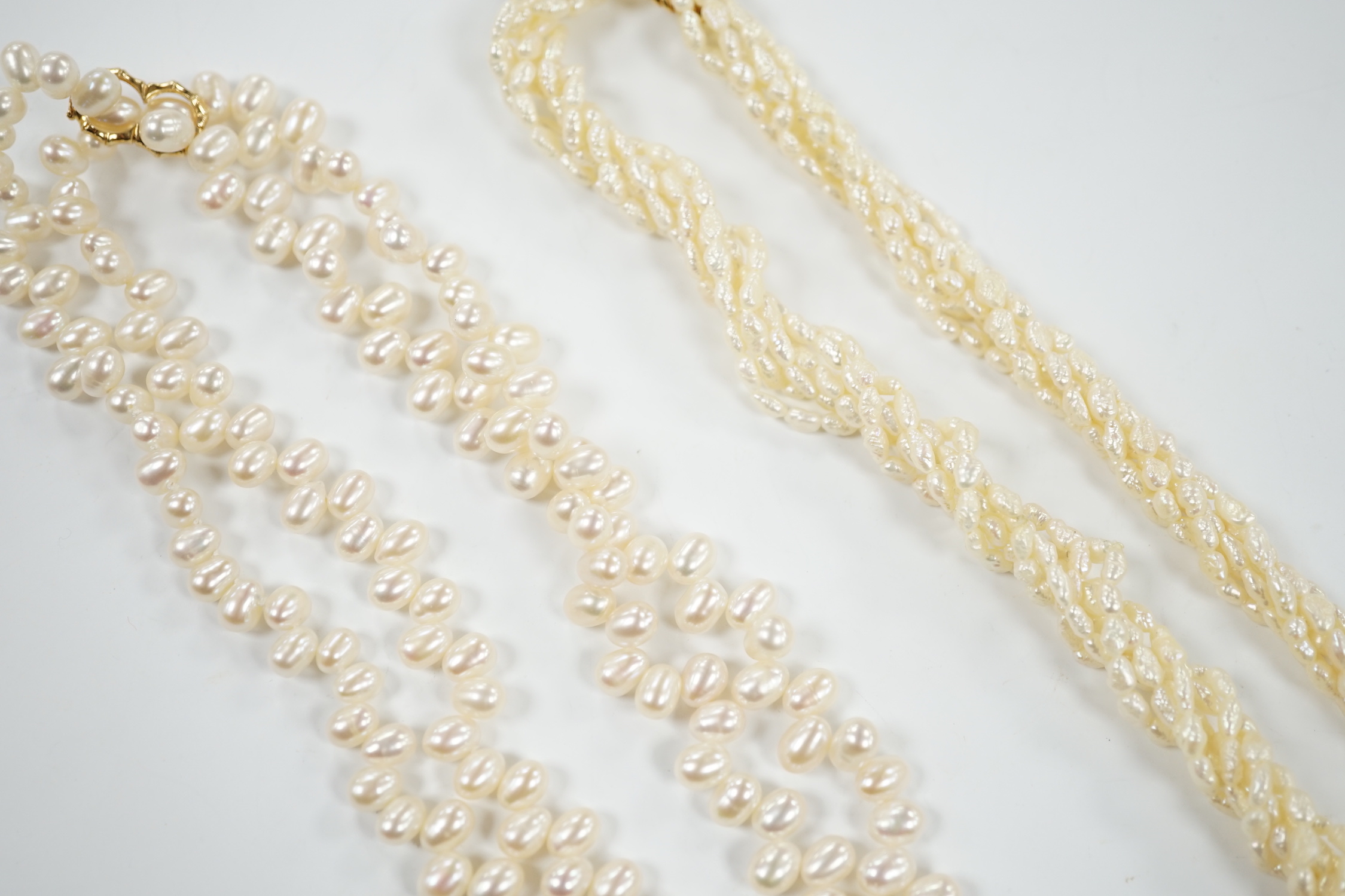 A double strand freshwater pearl necklace, with 585 yellow metal clasp, 50cm and one other freshwater pearl necklace with 585 yellow metal clasp.